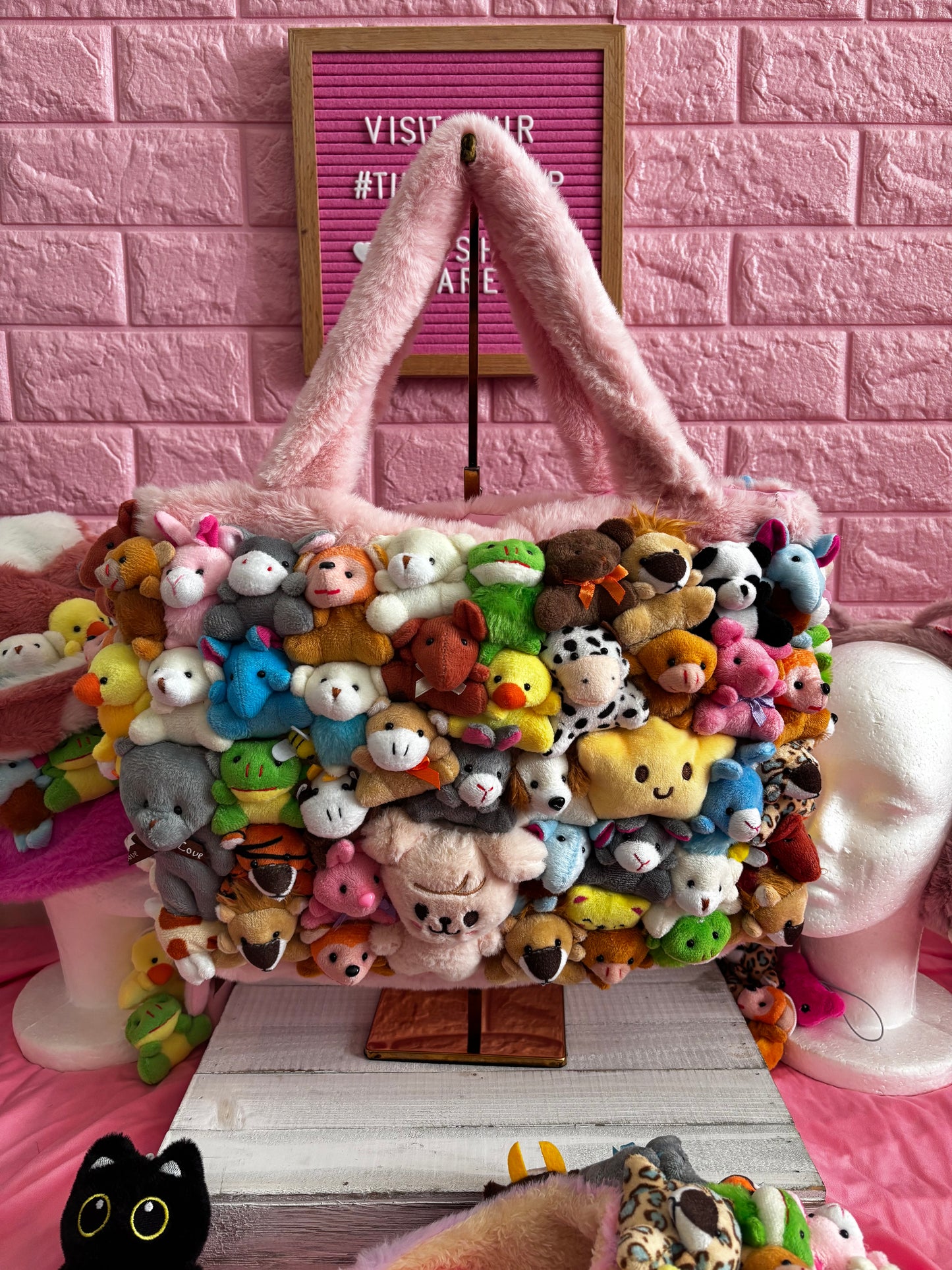 Colorful plush toy bag with various small plush toys.